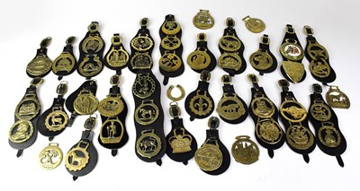 Lot 87 - A quantity of horse brasses on leather mounts.