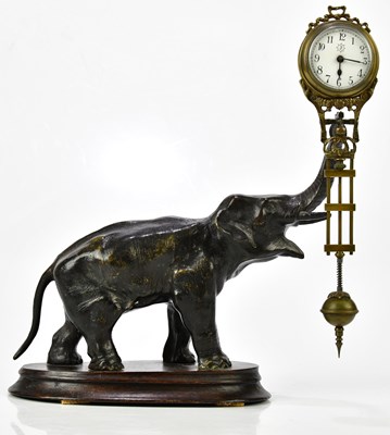 Lot 212 - A bronze spelter mystery clock modelled as an...