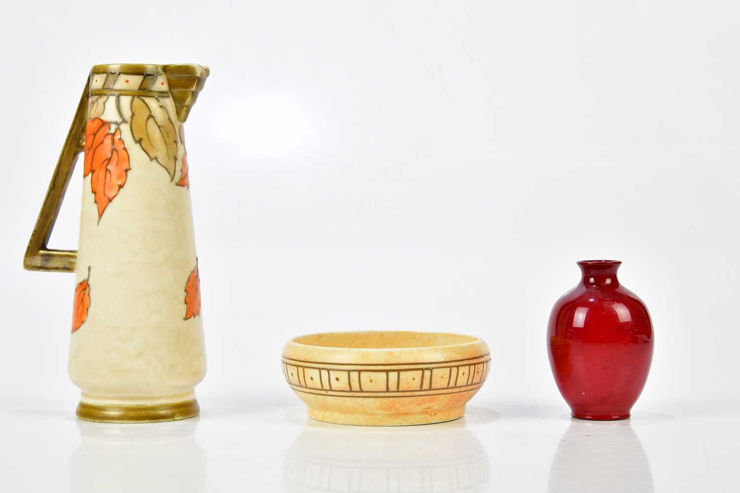 Lot 2248 - ROYAL DOULTON; a flambé miniature vase of...