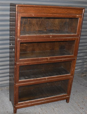 Lot 32 - An oak four tier stacking bookcase, height...