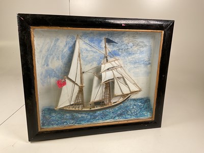 Lot 21 - A diorama of a masted vessel in painted glazed...