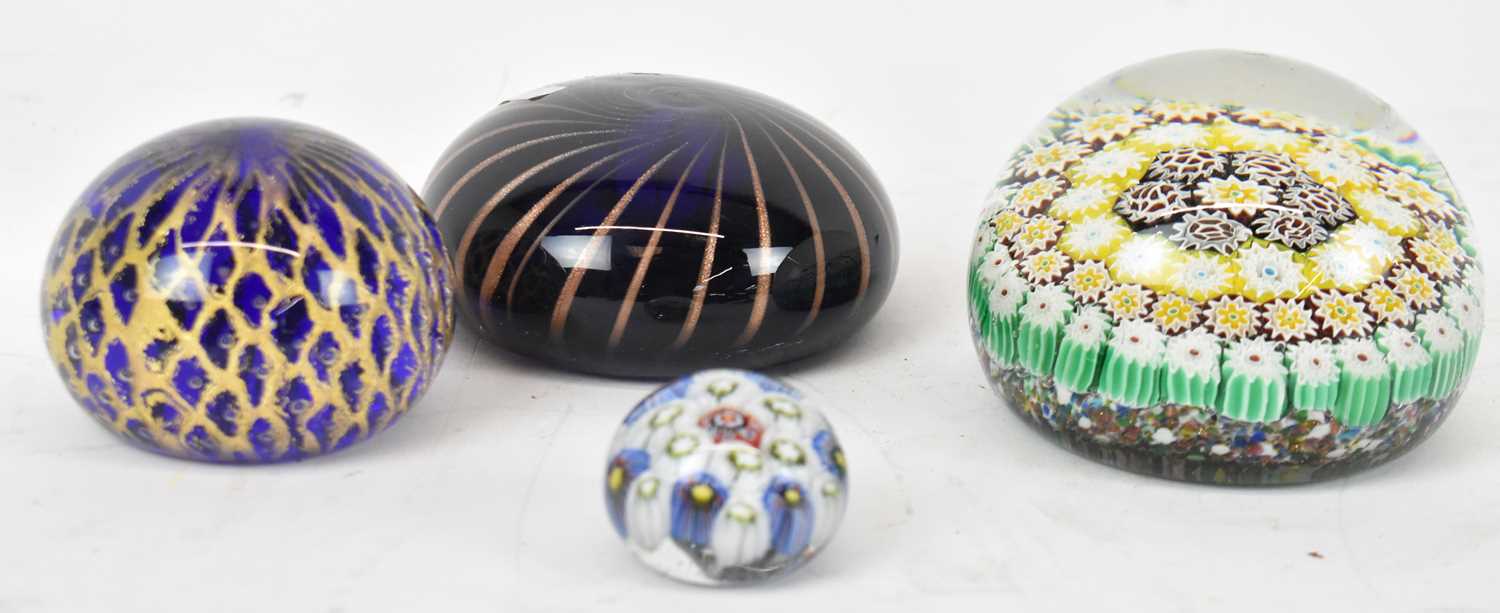 Lot 558 - MURANO; four assorted paperweights.