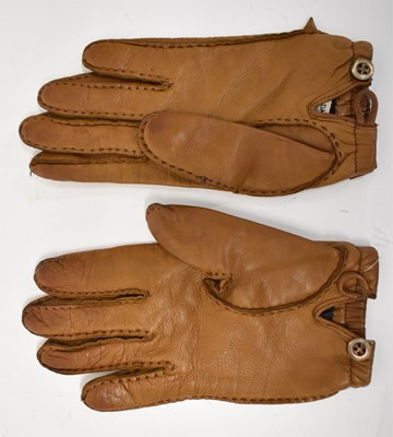 Lot 607 - PRADA; a pair of tan calf skin leather gloves...