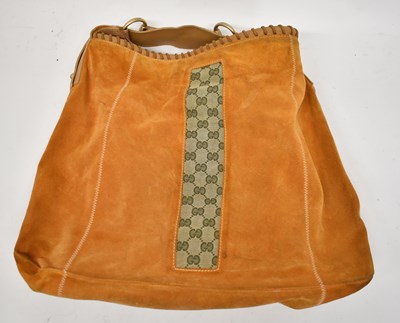 Lot 602 - GUCCI; a large vintage orange suede leather...