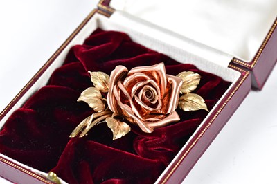 Lot 565 - A 9ct yellow and rose gold rosebud brooch...