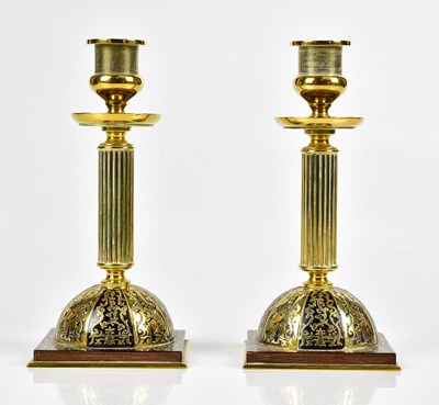 Lot 390 - A pair of late 19th century brass candlesticks,...