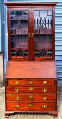 Lot 10 - A 19th century mahogany bureau bookcase, the...