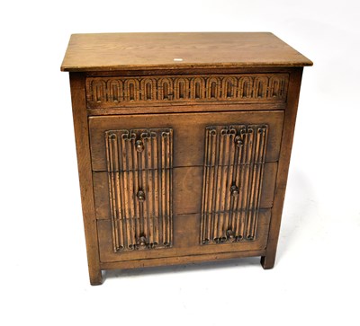 Lot 5 - An early 20th century oak priory-style four-drawer chest