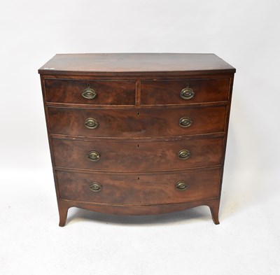 Lot 46 - A George III bow-fronted mahogany chest of two...