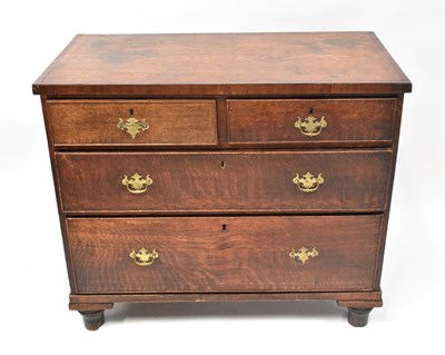 Lot 29 - A Georgian oak and mahogany cross-banded chest...