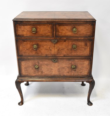 Lot 48 - An early 20th century walnut chest of two...