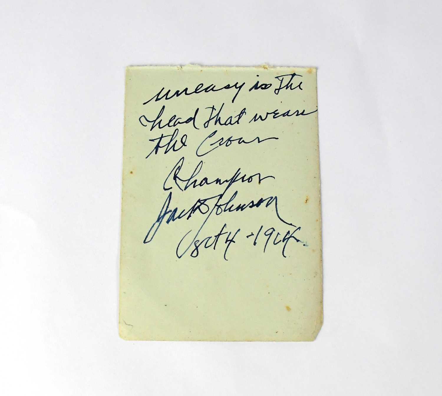 Lot 379 - JACK JOHNSON; a torn page from an autograph...