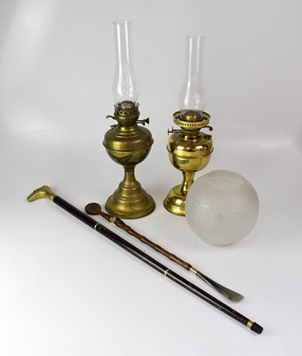 Lot 108 - Two brass oil lamps with funnels, one with an...