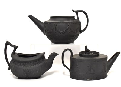 Lot 284 - Three 19th century black basalt teapots, to...