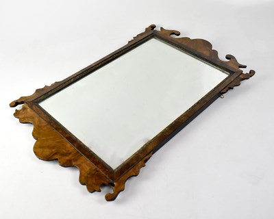 Lot 69 - A Georgian burr walnut fret carved wall mirror