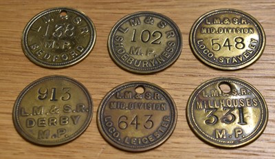 Lot 245 - LM&SR; six assorted tokens/tallies.