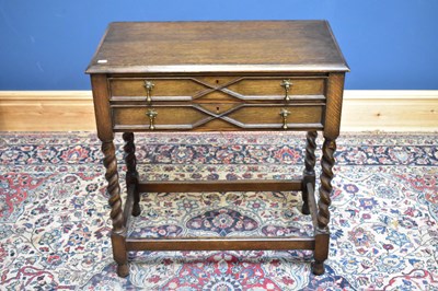 Lot 419 - An early 20th century oak two drawer canteen...