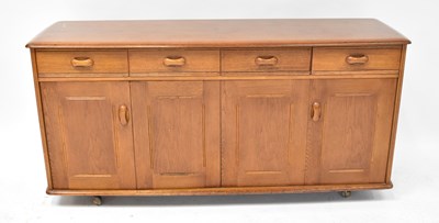 Lot 49 - A mid-20th century oak sideboard, comprising...