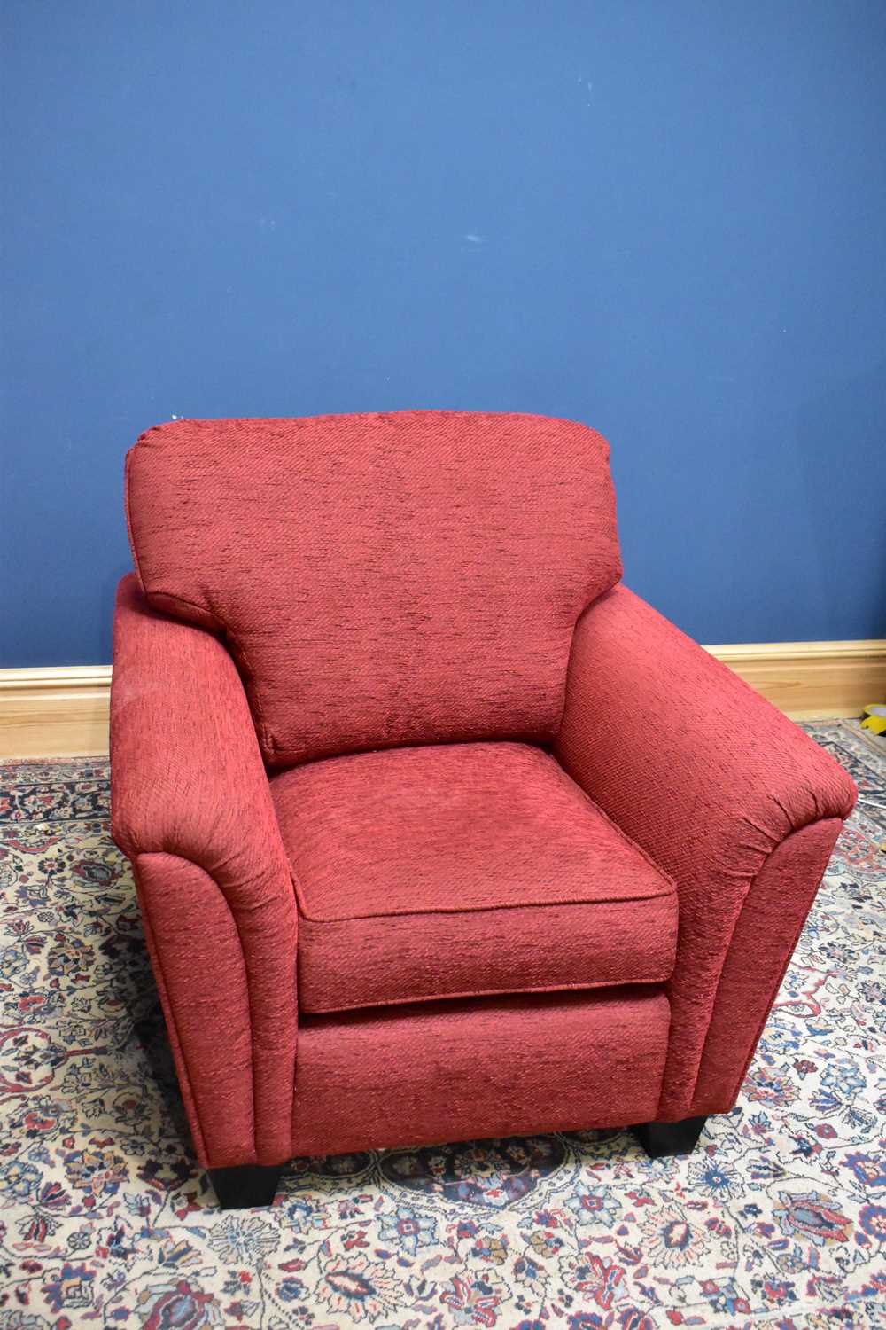 Lot 2674 - A modern red upholstered lounge chair.