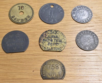 Lot 254 - LMS; seven assorted tokens/tallies.