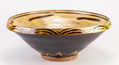 Lot 112 - CLIVE BOWEN (born 1943); a large slipware bowl...