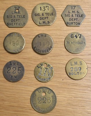 Lot 230 - LMS; ten assorted brass tokens/tallies.