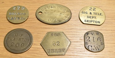 Lot 256 - GWR; six assorted brass tokens/tallies