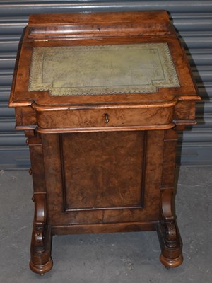 Lot 76 - A Victorian walnut Davenport desk.