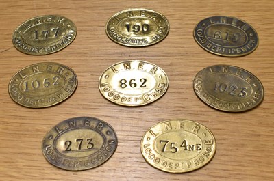 Lot 240 - LNER; eight assorted oval brass tokens/tallies.