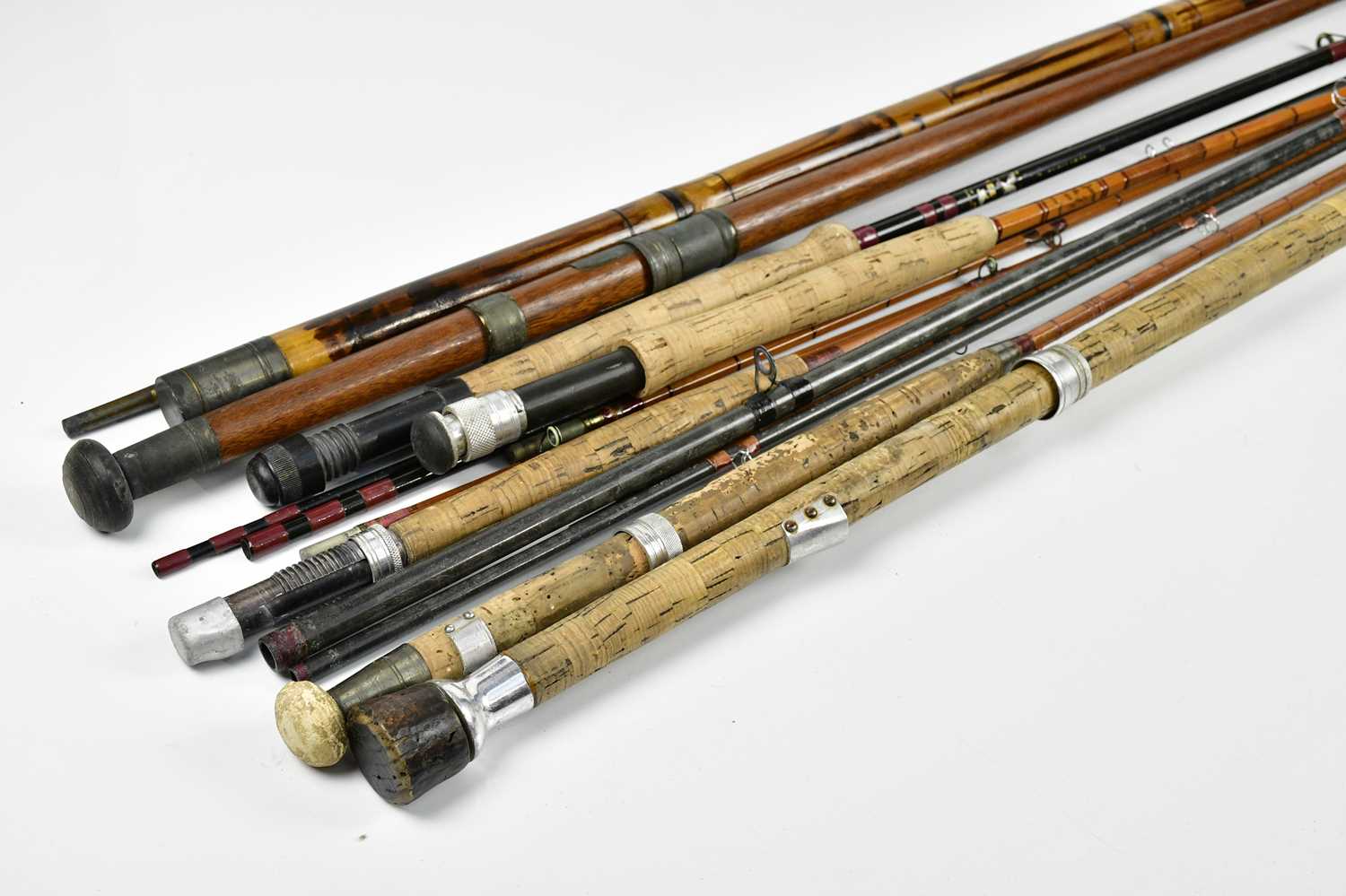 Lot 1386 - Six vintage split cane fishing rods in cases.