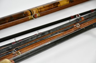 Lot 1386 - Six vintage split cane fishing rods in cases.