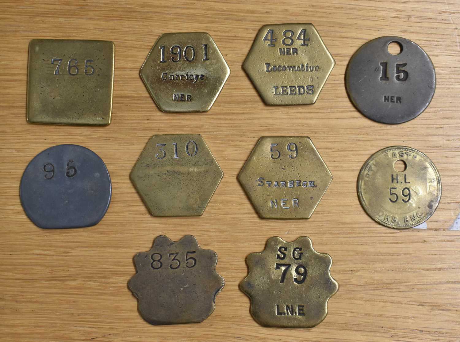 Lot 232 - NER; ten assorted tokens/tallies.