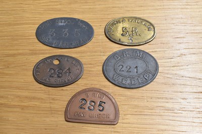 Lot 260 - BR; five assorted tokens/tallies.