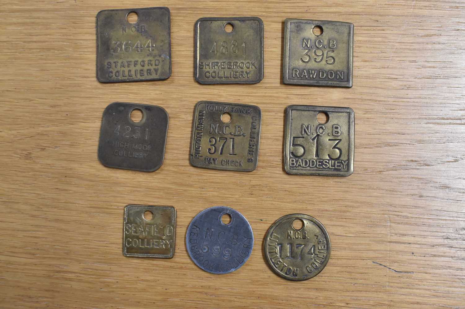 Lot 237 - NCB; nine assorted tokens/tallies.