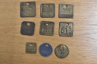 Lot 237 - NCB; nine assorted tokens/tallies.