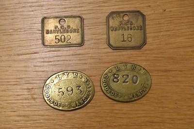 Lot 278 - LYR; two oval brass tokens/tallies, also two...