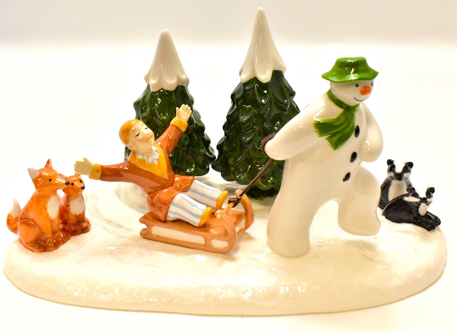 Lot 569 - COALPORT; a The Snowman 'Winter Fun' figure...