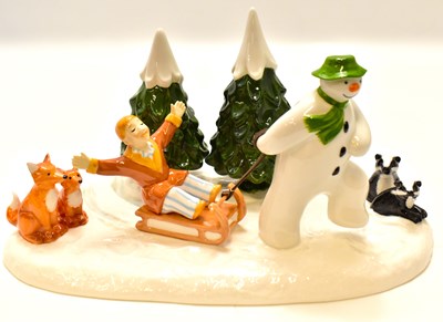 Lot 569 - COALPORT; a The Snowman 'Winter Fun' figure...