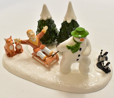 Lot 569 - COALPORT; a The Snowman 'Winter Fun' figure...