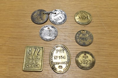 Lot 236 - Eight assorted time/paycheck tokens/tallies