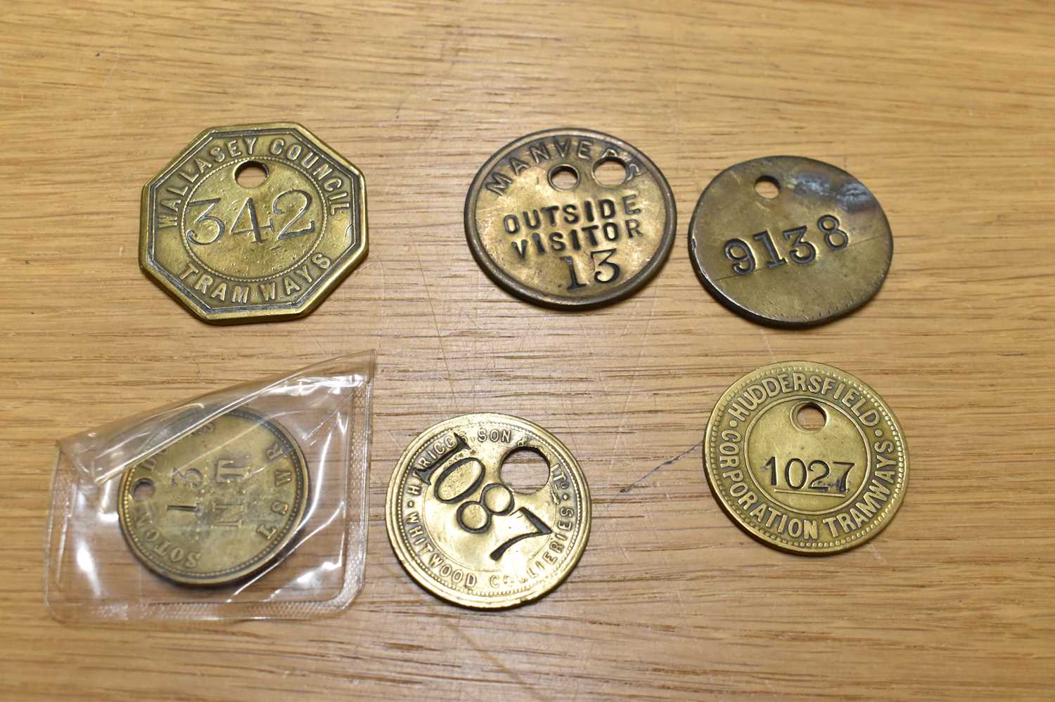 Lot 266 - Six assorted brass railway tokens/tallies.