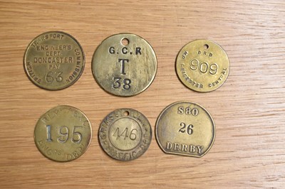 Lot 269 - Six assorted brass railway tokens/tallies.