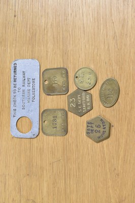 Lot 270 - Six assorted brass railway tokens/tallies and...