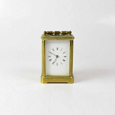 Lot 83 - A brass cased carriage clock, the white...