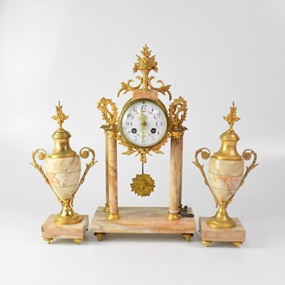 Lot 82 - A French marble and ormolu mounted clock...