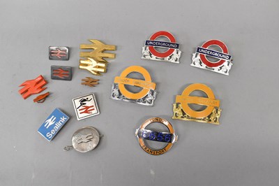 Lot 301 - Three London Transport cap badges, two...