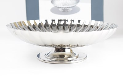 Lot 610 - GEORG JENSEN; a stainless steel dish on stand...