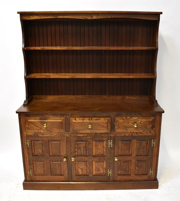 Lot 40 - A reproduction oak dresser, the boarded plate...