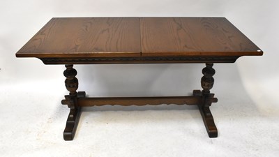 Lot 19 - OLD CHARM; a reproduction oak extending...