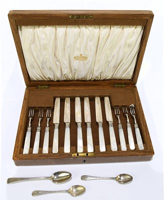 Lot 244 - An oak cased canteen of silver plated pickle...